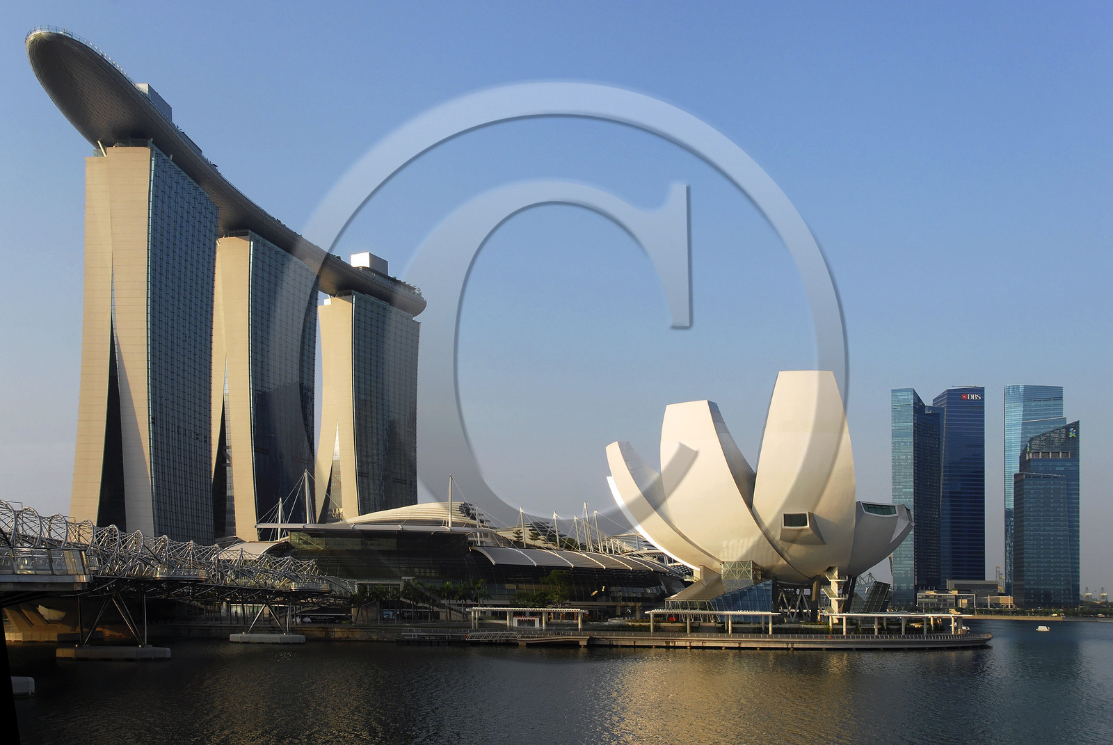 Singapore, Marina Bay, Helix Bridge (on the left) and Marina Bay Sands Hotel opened in 2010, and the ArtScience Museum in the shape of a lotus flower, both designed by architect Moshe Safdie.